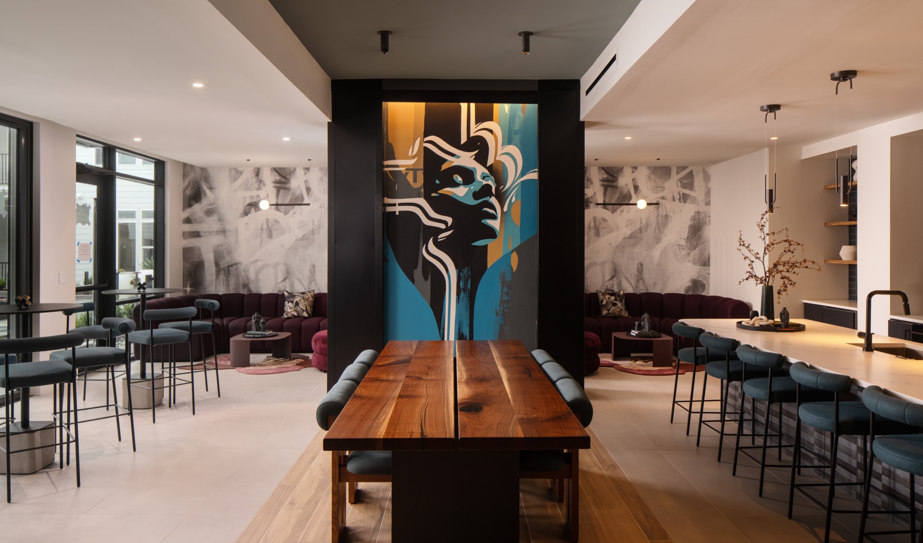 room with ample seating and a painting on the wall 