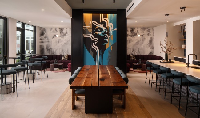 room with ample seating and a painting on the wall 