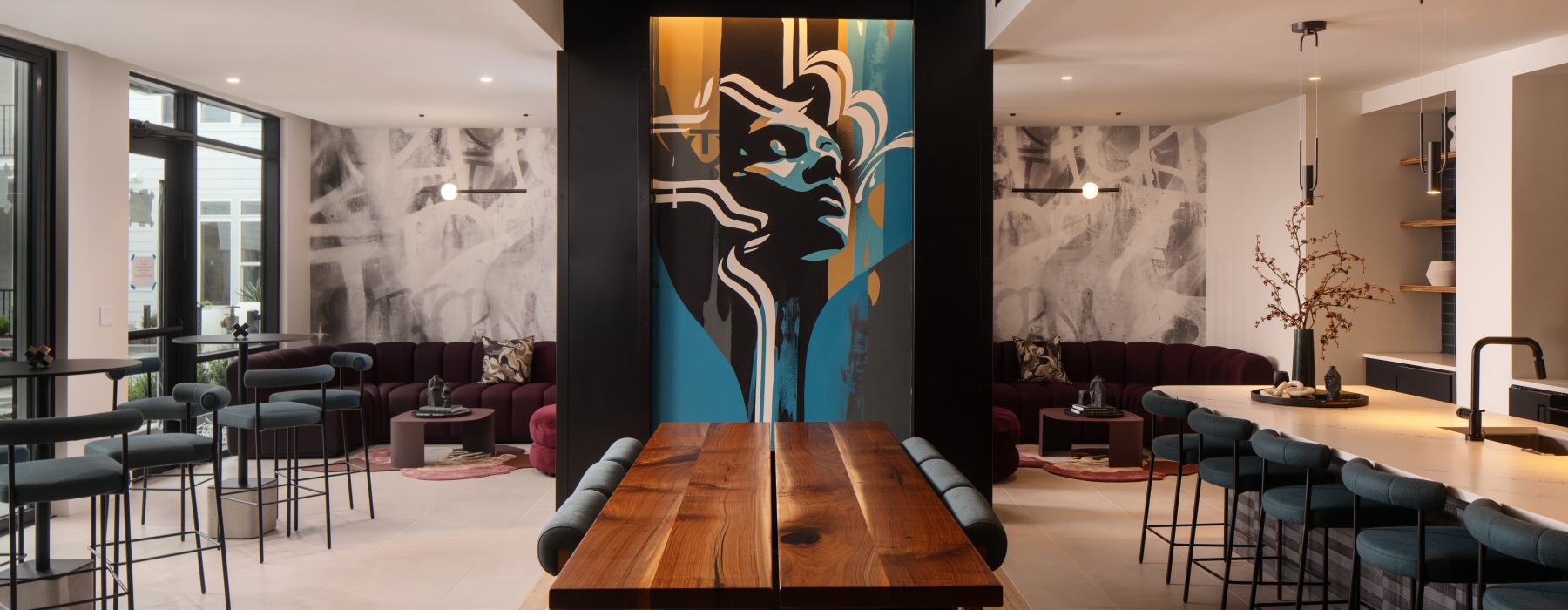 room with ample seating and a painting on the wall 