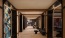 a long hallway entrance with art on the walls 