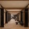 a long hallway entrance with art on the walls 