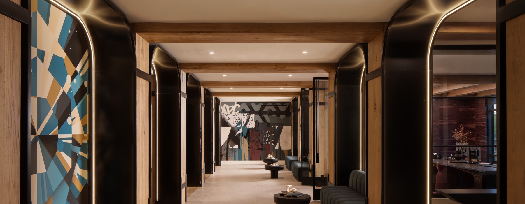 a long hallway entrance with art on the walls 