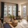 well lit living room with large windows and seating 