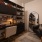 a room with a desk and seating 