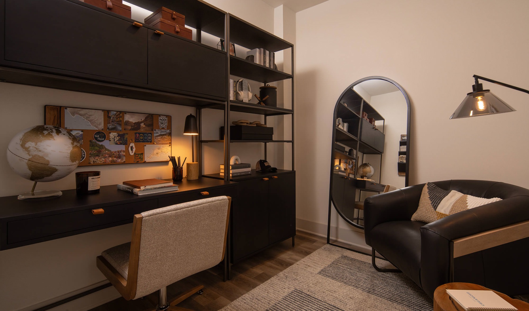 a room with a desk and seating