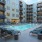 a pool in a courtyard between buildings