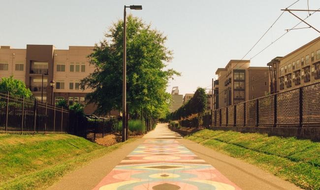 The essence of exceptional living a path with buildings on the side
