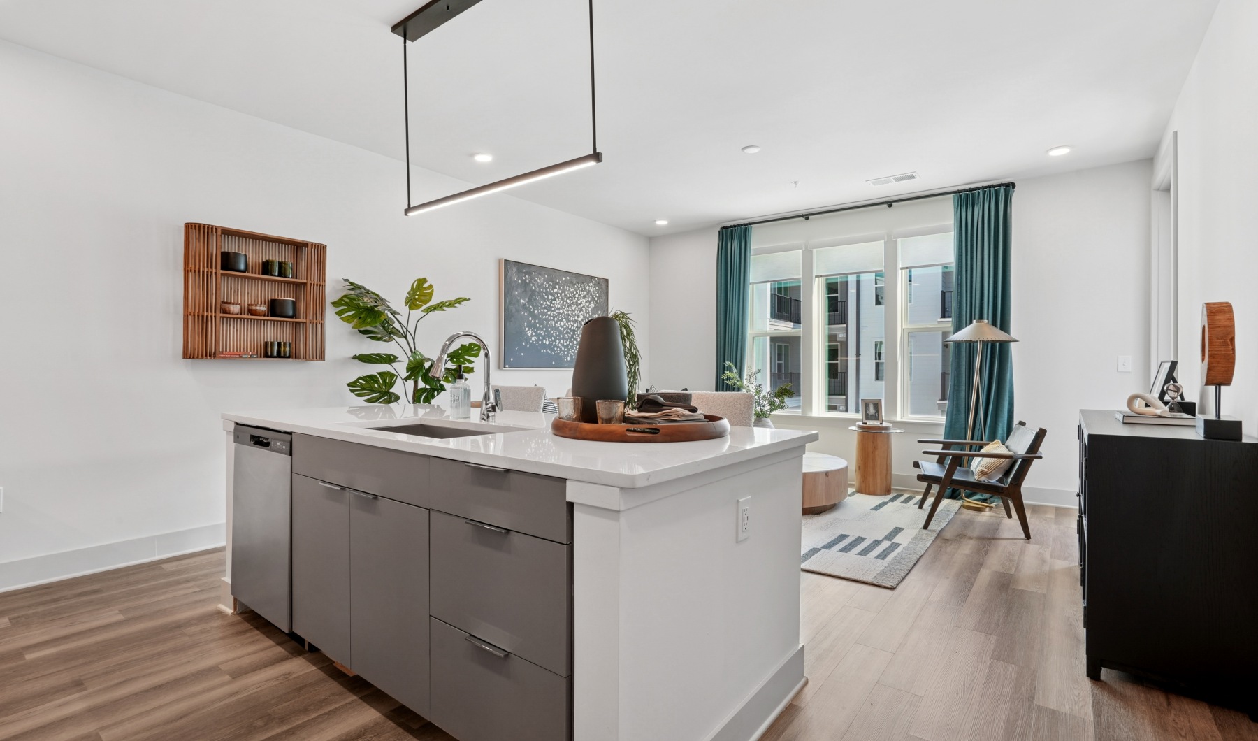 Kitchen island overlooking bright living room 