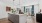 Kitchen island overlooking bright living room 