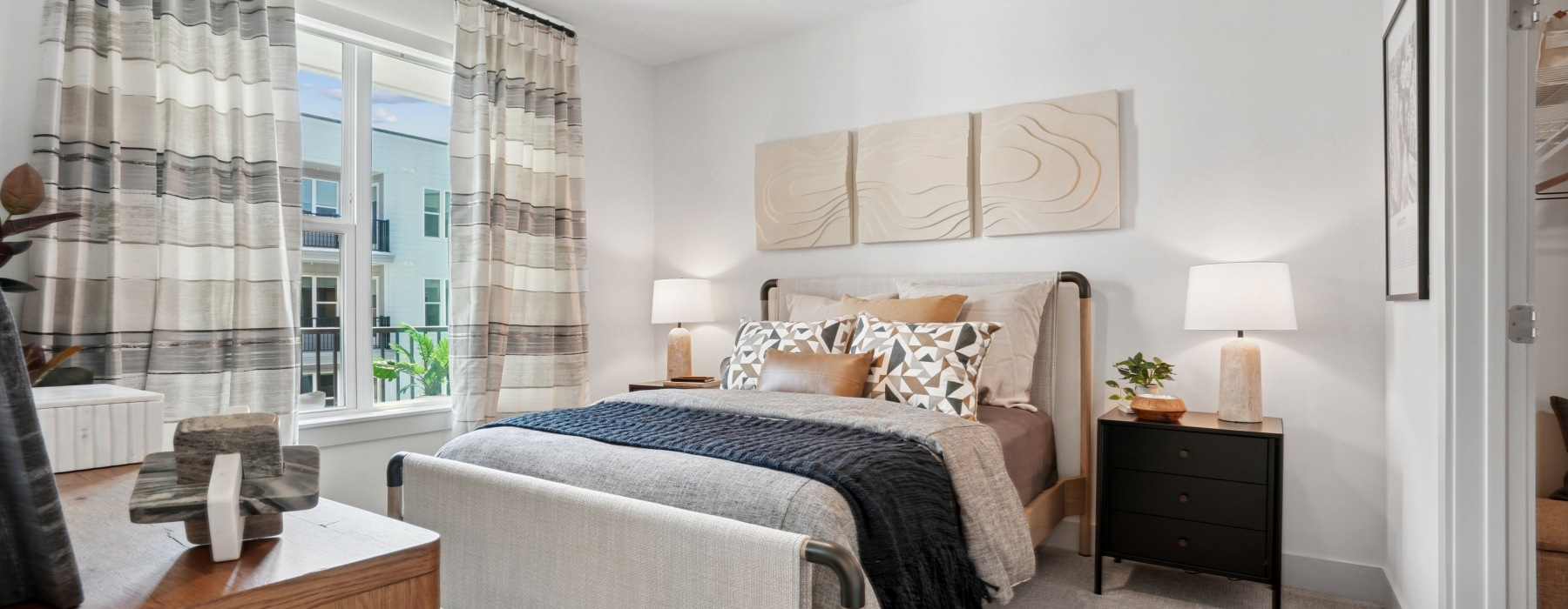 a bedroom with a bed and a dresser