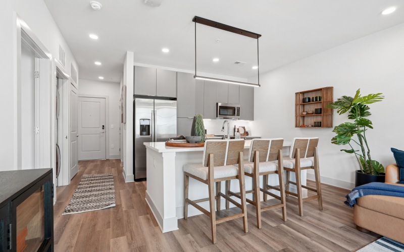 a kitchen with a island and couches