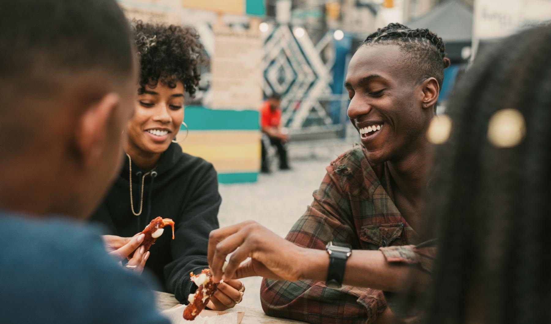 The essence of exceptional living a group of men sitting at a table